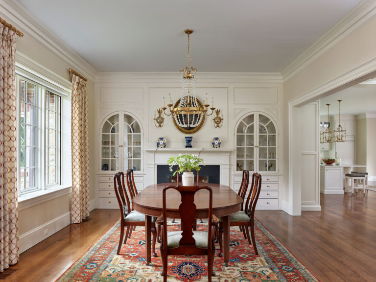 dining room with built ins and fireplace