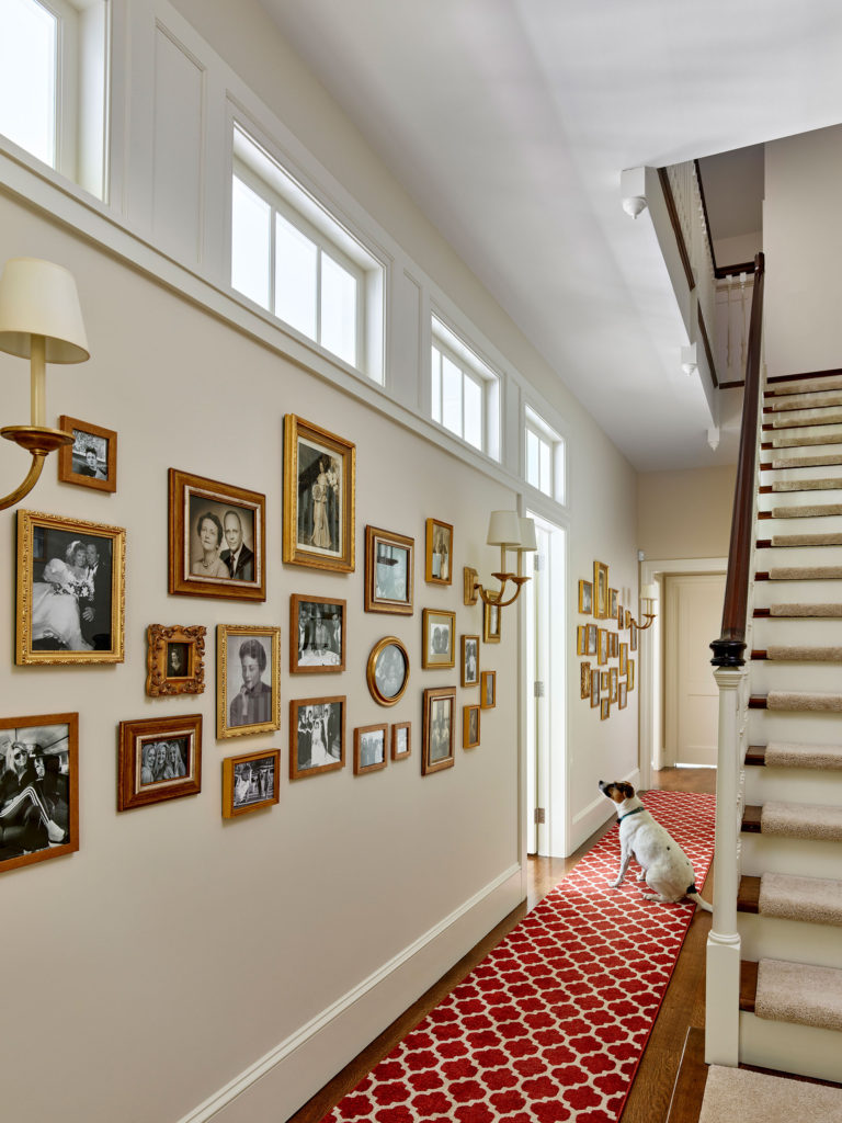 gallery wall in stair hall