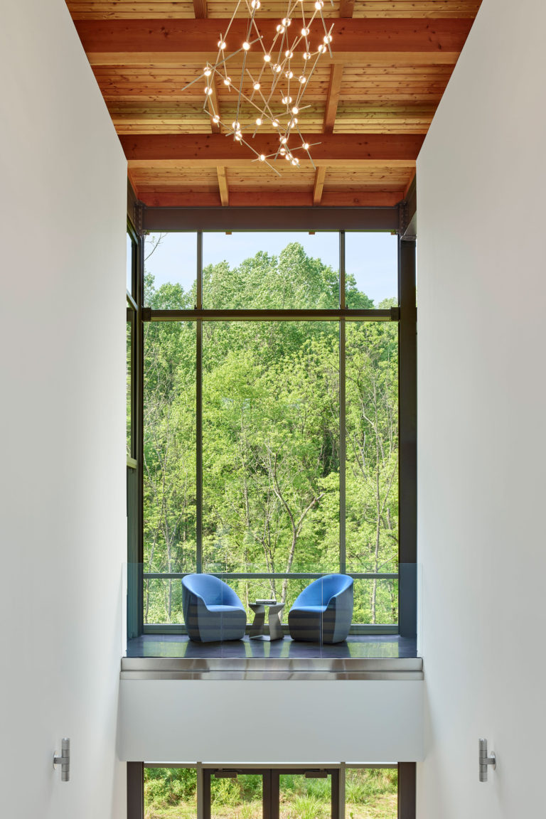 modern office building sitting area with large windows