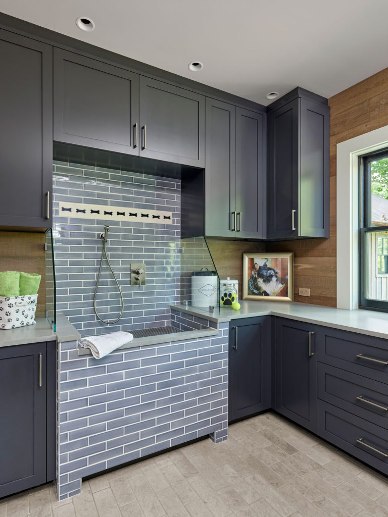 Gray tiled dog wash in laundry room