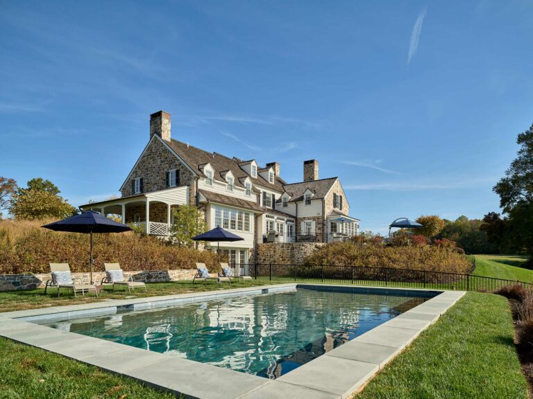 Pool and rear elevation of Chester County farmhouse