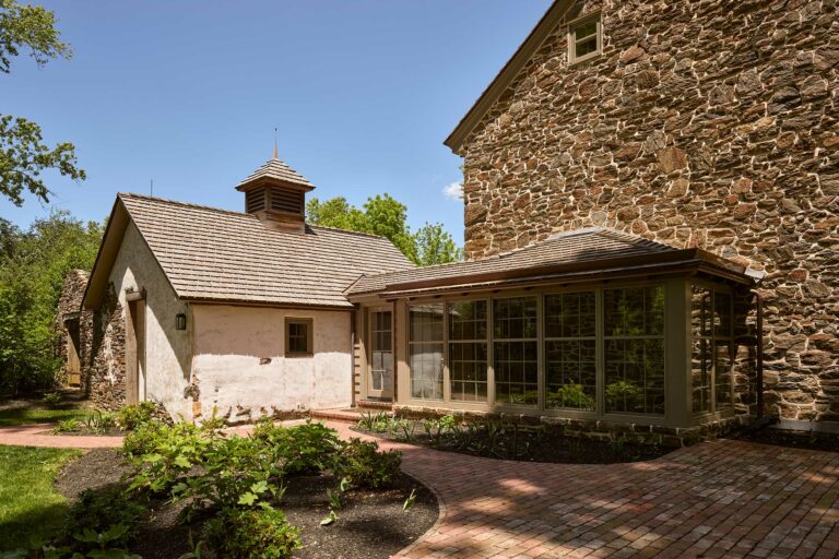 Side elevation with spring house and covered porch addition at Big Bend in Chadds Ford Pennsylvania