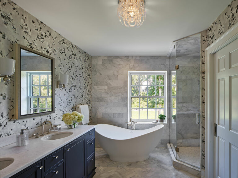Soaking tub in master bath with wallpapered walls