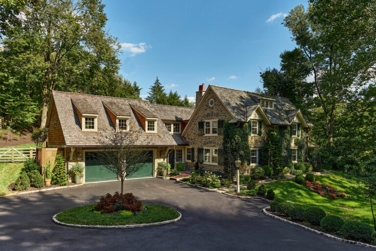 New garage with second story library and new family entry for a cottage in Gladwyne