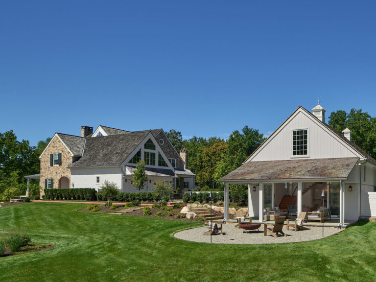 New stone home with standalone garage including recreational room and firepit at Evergreen Farm