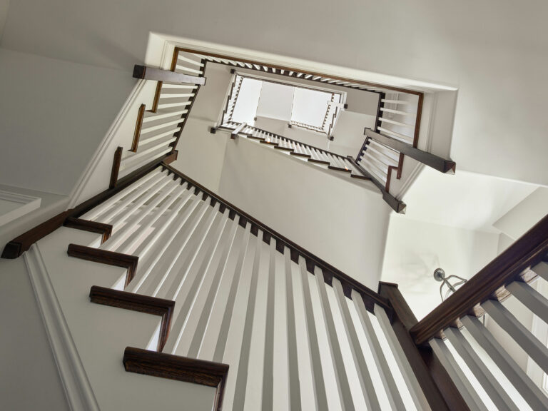 View looking up through center of winding staircase at Evergreen Farm