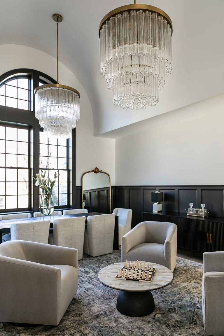 dramatic dining room with barrel vaulted ceiling and chandeliers