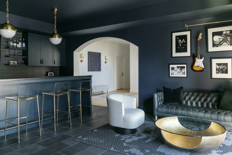 dark blue moody basement bar for entertaining in home in Fort Washington, Pennsylvania