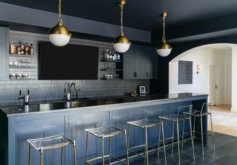 dark blue moody basement bar for entertaining in home in Fort Washington, Pennsylvania