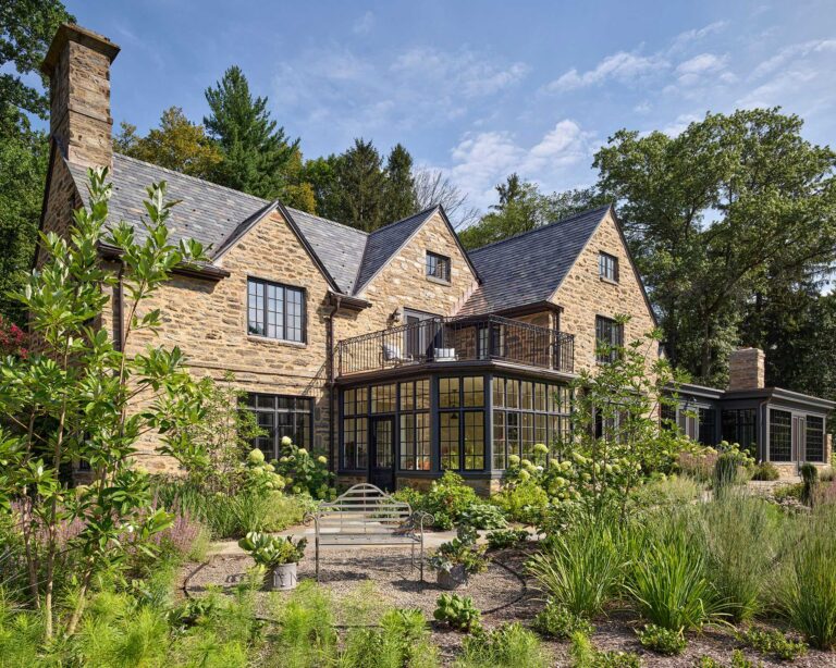 Main Line Manor view of exterior rear solarium entry and additions in Gladwyne