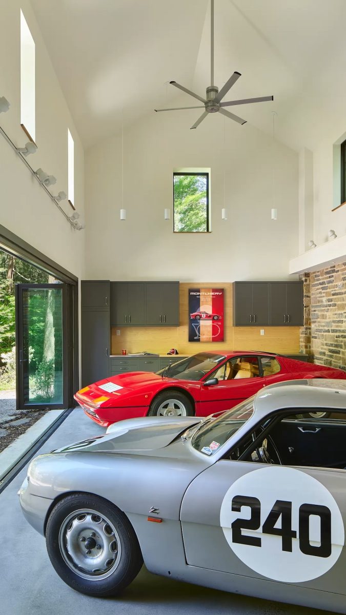 A folding glass door system spanning the length of this garage facade